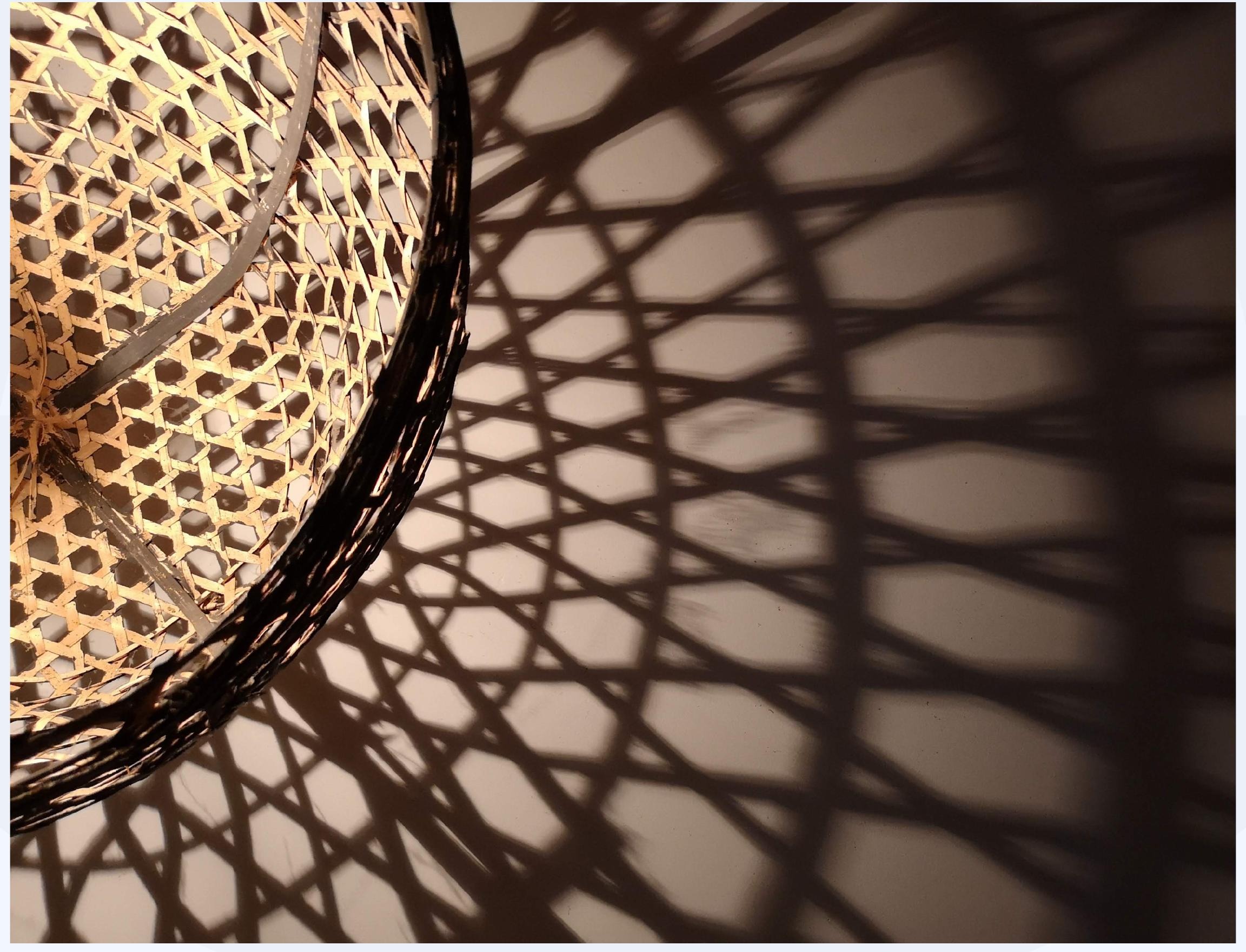 Woven basket casting a geometric shadow pattern